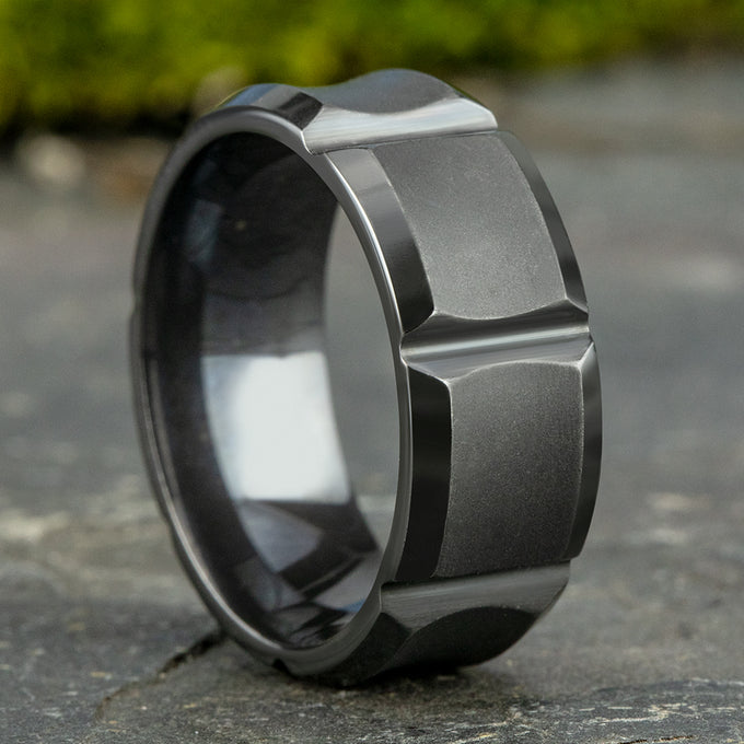 Black leather gauntlet with silver studs and buckle detailing.